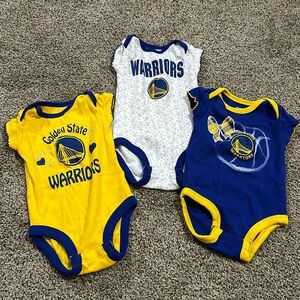Toddler girls Golden State Warriors onesies.